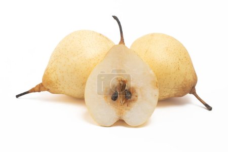 Half cut and two whole fresh organic yellow pear delicious fruit isolated on white background clipping path