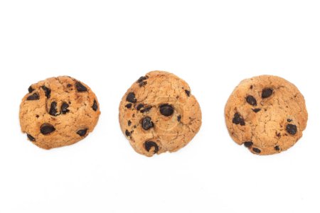 Three chocolate chip cookies top view isolated on white background clipping path