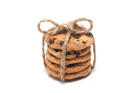 Stacked of chocolate chip cookies tied with twine rope isolated on white background clipping path
