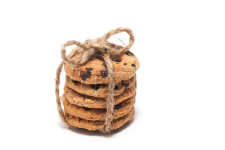 Stacked of chocolate chip cookies tied with twine rope isolated on white background clipping path