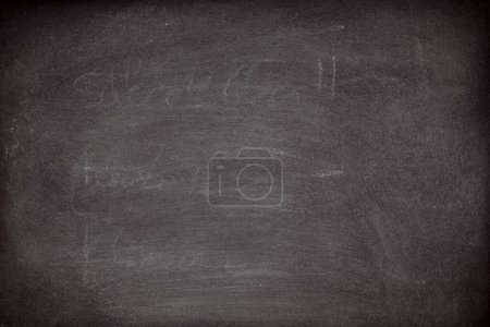 Foto de Abstract Chalk rubbed out on blackboard or chalkboard texture. clean school board for background or copy space for add text message. Backdrop of Education concepts. - Imagen libre de derechos