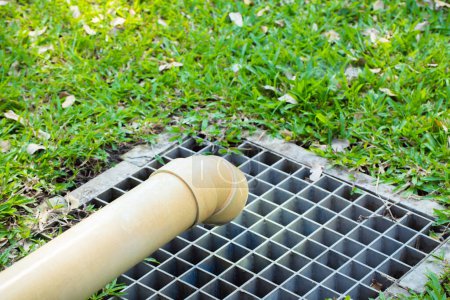 Photo for Steel drain out in the lawn outdoor with green grass. - Royalty Free Image