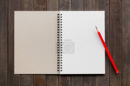 Photo for Open notebook with white lined pages and pencil on book - Royalty Free Image