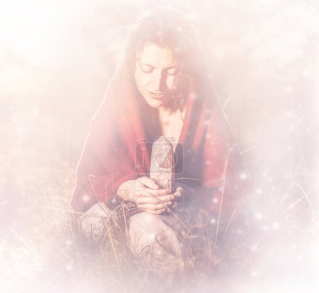 Photo for Beautiful shaman woman in nature and ceremony of the earth. Woman holding a large crystal of rosary in her hands. Fine painting effect - Royalty Free Image