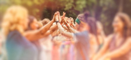 Photo for People holding hands at a festival ceremony - Royalty Free Image