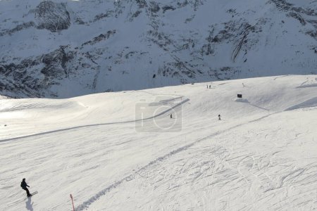 Photo for Sportgastein ski resort in the Austrian Alps. Skiers on the slope. Winter sunny day. - Royalty Free Image