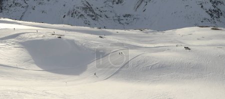 Photo for Skiers on the slope. Sportgastein ski resort in the Austrian Alps. Winter sunny day. - Royalty Free Image