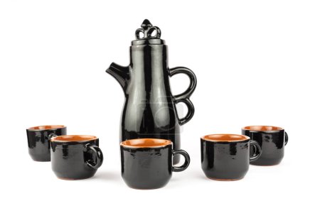 Photo for Set of black earthenware, tall teapot, cups - Royalty Free Image