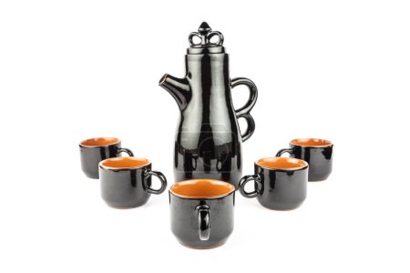 Photo for Set of black earthenware, tall teapot, cups - Royalty Free Image