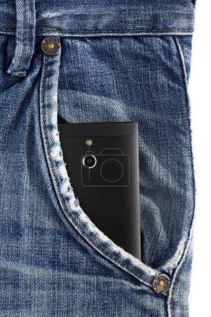 Photo for Black mobile phone with a camera in the pocket of denim trousers. - Royalty Free Image