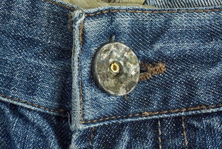Photo for Button on denim pants photographed close up - Royalty Free Image