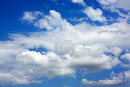 Photo for White cumulus clouds against the blue sky. Blue sky on a sunny day. - Royalty Free Image