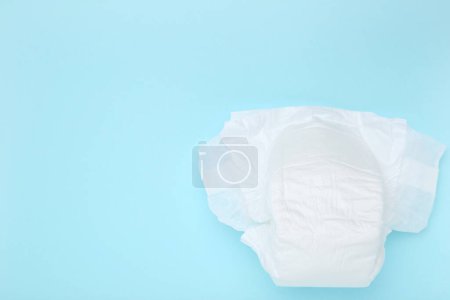 Photo for Baby diaper on blue background - Royalty Free Image