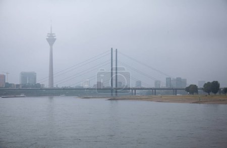 Panoramic view of the Rhine river in Dusseldorf, Germany in a foggy day.