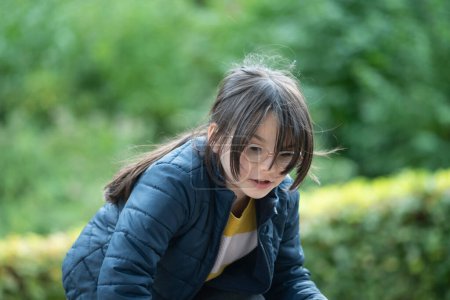 Japanese girl playing in the park (selective focus)