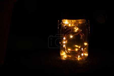 Blurred circles of lights on a dark background in a jar