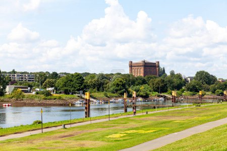 Panoramic view of the Weser River in the center of Bremen, Germany. Ancient water tower in the background