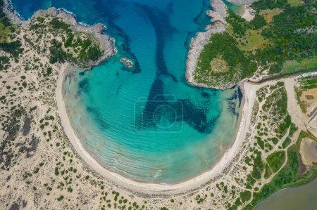 Aerial drone photo of the iconic  semicircular sandy beach of Voidokoilia in Messinia, Gialova, Peloponnese, Greece