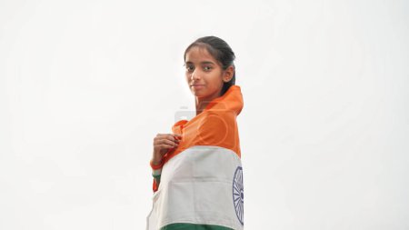 Photo for Happy cute girl wrapped indian flag around her body celebrating Independence day or Republic day. - Royalty Free Image