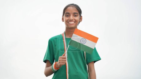 Photo for Cute girl with Indian National Tricolour Flag, Isolated over white background. Suitable for Independence Day or Republic Day concept - Royalty Free Image