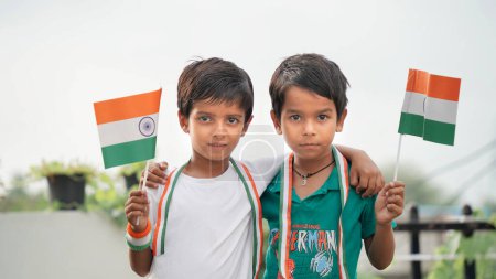 Photo for Small kids holding Indian flags on the occasion of Independence Day India celebrations - Royalty Free Image