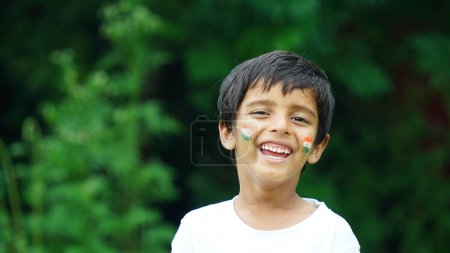 Photo for Cute little boy with Indian Flags painted on cheeks - Royalty Free Image