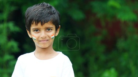 Photo for Cute little boy with Indian Flags painted on cheeks - Royalty Free Image