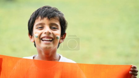 Photo for Cute little boy with Indian National Tricolour Flag - Royalty Free Image