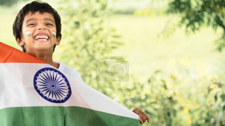 Photo for Cute little boy with Indian National Tricolour Flag - Royalty Free Image