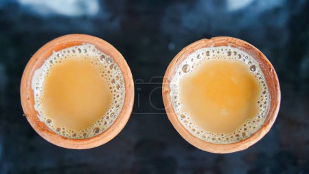 Photo for The kulhad Chai , is a typical tea from India. there is a spice flavor, and served in clay cups. - Royalty Free Image