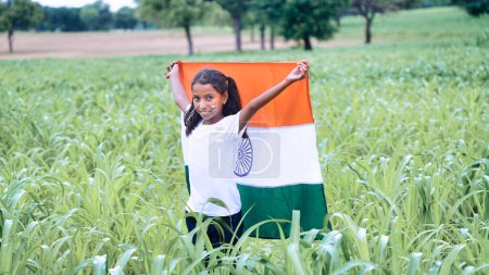 Photo for Indian girl celebrating indian independence day. gorl with flag in the field - Royalty Free Image