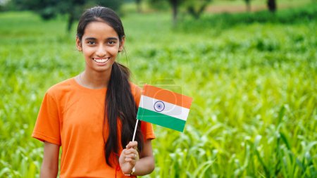 Photo for Indian girl celebrating indian independence day or Republic Day concept. Girl with Indian National Tricolour Flag - Royalty Free Image