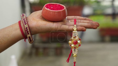Photo for Indian festival: Raksha Bandhan. A traditional Indian wrist band which is a symbol of love between Brothers and Sisters. - Royalty Free Image