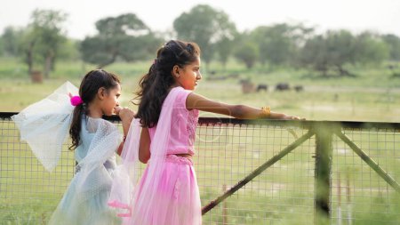 Photo for Portrait of beautiful little indian girls standing in the park - Royalty Free Image