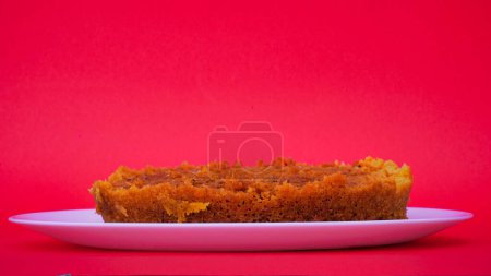 Photo for Indian Rajasthani crunchy sweet dish called Ghevar or Ghewar is an made using refined flour, sugar, and ghee. Generally prepared in festive season of Teej with milk products. - Royalty Free Image