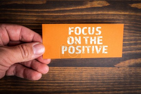 Photo for Focus on the Positive. Piece of paper with a text in a mans hand. - Royalty Free Image
