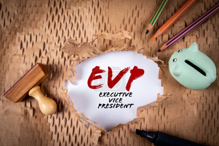 Foto de EVP, Executive Vice President. Piggy bank, stamp and colored pencils on torn paper background. - Imagen libre de derechos
