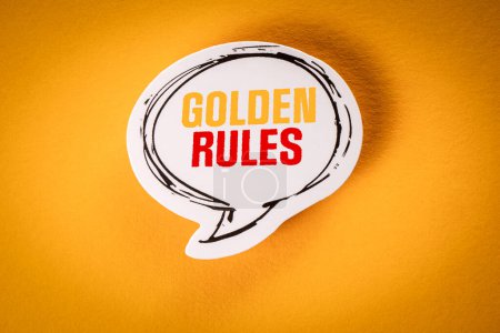 Goldene Regeln. Sprechblase mit Text auf gelbem Hintergrund.