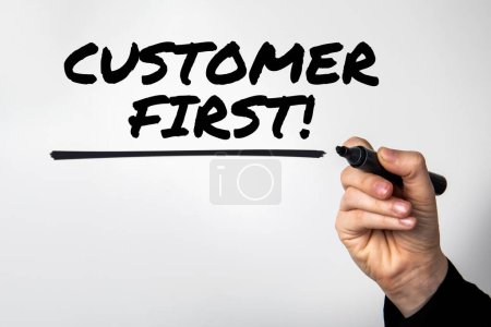 Photo for Customer First. Hand with marker writes text. - Royalty Free Image
