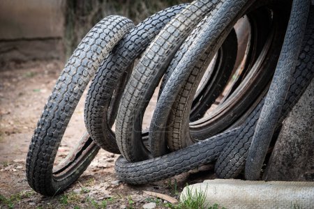 Old motorcycle and bicycle tires. Recycling Concept.