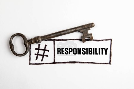 Responsibility Concept. Door key and text on a white background.