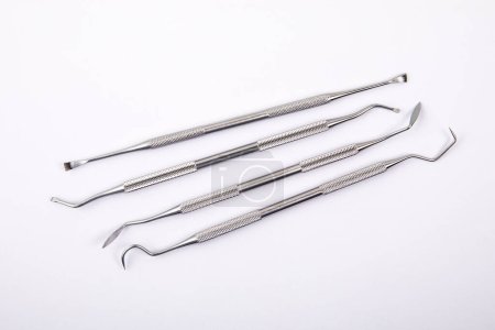 Photo for Set of dental instruments on a white background. Steel. - Royalty Free Image