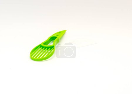 Photo for All-in-one avocado slicer knife and non-slip silicone handle isolated on white background. Dishwasher safe cutter and pitter tool for avocado - Royalty Free Image