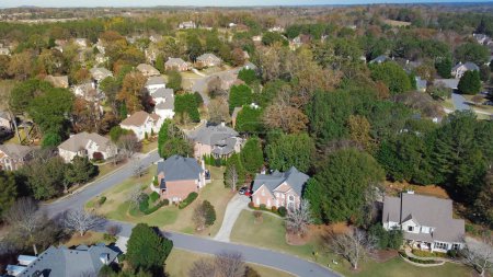 Photo for Subdivision urban sprawl row of two-story single-family house in leafy suburbs master planning residential neighborhood near Atlanta, Georgia, USA. Aerial view low-density upscale homes - Royalty Free Image