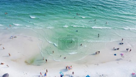 Photo for Gorgeous shade of blue and crystal-clear turquoise water of Santa Rosa beach, brilliantly white sandy shore with people swimming, relaxing laid-back vibe charming Walton County, Florida, USA. Aerial - Royalty Free Image