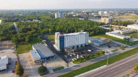 Photo for Office buildings, multi-story hotels, business park, car rental, restaurants along Interstate Highway 10 (I-10) in downtown Little Woods, urban neighborhoods New Orleans, Louisiana, USA. Aerial view - Royalty Free Image