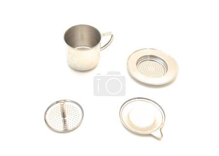 All parts of screw down type traditional Vietnamese coffee filter (phin ca phe) made from stainless steel isolated on white background, popular preparation metallic filter cup. Drip maker press