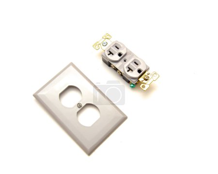 Photo for Polycarbonate wall plate with gray finish industrial grade duplex receptacle 20A-125V capacity, 5-leaf brass, superior plug retention isolated on white background. 3-prong outlet plug copy space - Royalty Free Image