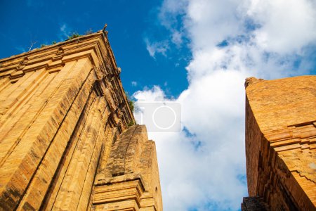 Photo for Upward view of North Tower or Thap Chinh and Central Tower or Thap Nam of Ponagar Cham Towers with terraced pyramidal roof, built partly of recycled bricks, actively worship by Cham. Nha Trang, VN - Royalty Free Image