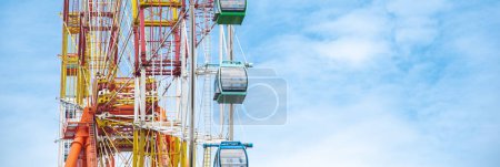 Photo for Panorama double A stand unilateral support, central shaft, slewing bearing, wire rope, outer rim, sightseeing cabin multiple passengers carrying components colorful Ferris Wheel, Nha Trang. Vietnam - Royalty Free Image